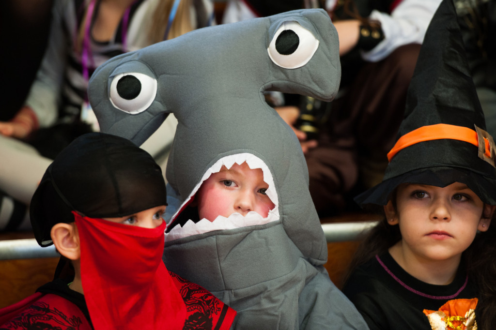 Andy Murphy sits in the stands as a hammerhead shark as he waits for the parade to begin in the gymnasium of High Falls Elementary School on Friday, October 30, 2015 in Robbins, North Carolina.