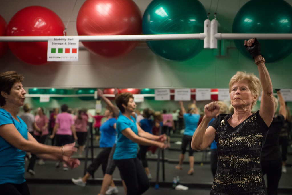 Nan Wood (right), along with other classmates, go through the various high-intensity exercises during a Tabata class at the Senior Enrichment Center on Monday, November 23, 2015 near West End, North Carolina.